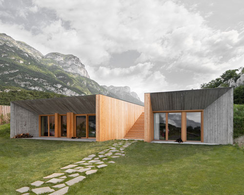 exposed concrete + larch façades clad studio raro's agritour farmhouse in trento, italy