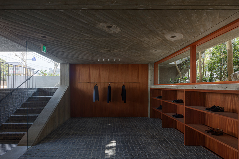 toru shimokawa wraps concrete 'belt' around boutique clothing store in japan