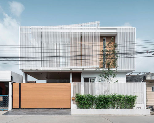 TOUCH architect clads 'house enfold' with a curved shading device in thailand