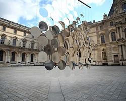 vincent leroy envisions distorting lens installation in front of the louvre