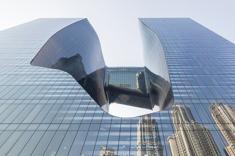 zaha hadid's 'opus' building in dubai photographed by laurian ghinitoiu