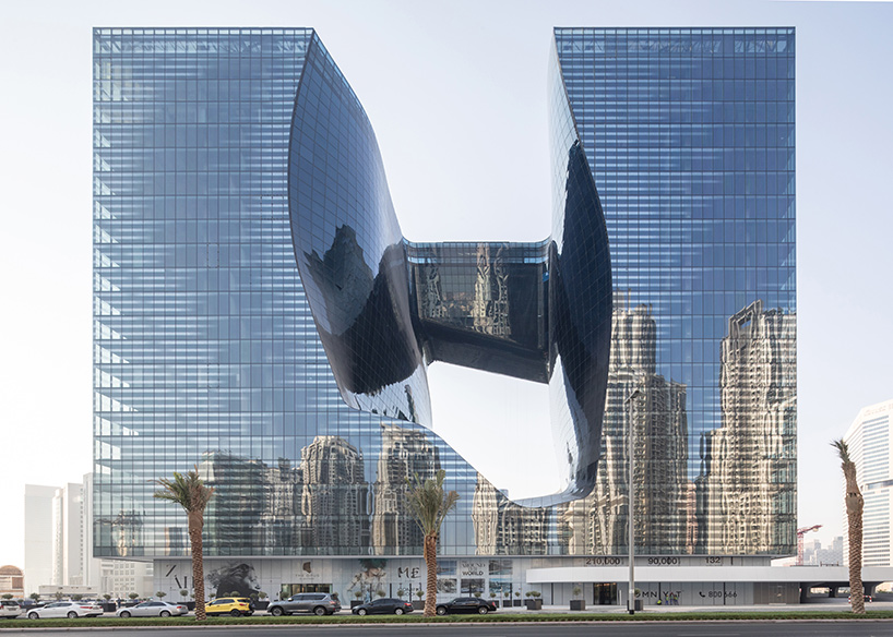 zaha hadid's 'opus' building in dubai photographed by laurian ghinitoiu