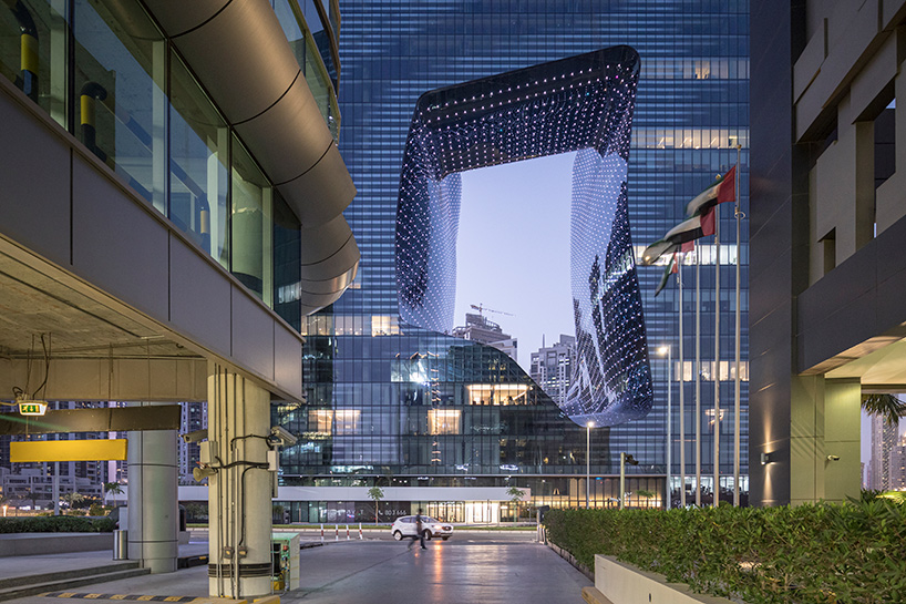 zaha hadid's 'opus' building in dubai photographed by laurian ghinitoiu