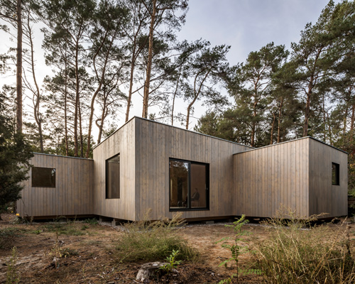 zeller & moye completes woodland retreat in germany comprising five timber volumes