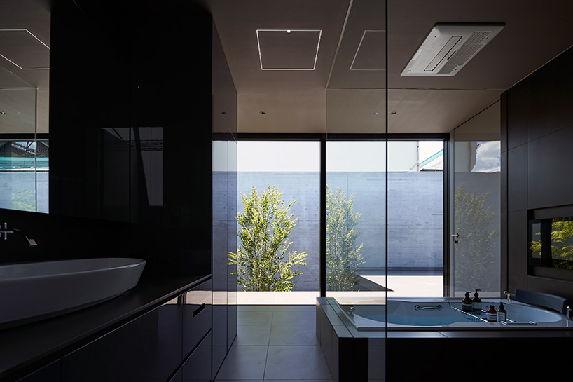 apollo architects builds 'ortho' residence in japan with massive offset concrete volumes