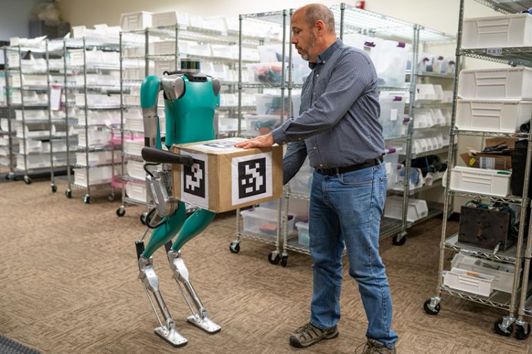foldable agility robotics delivery bot squats in as your workout partner
