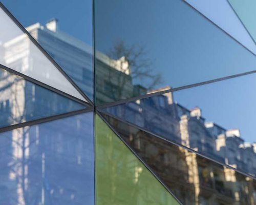 aldric beckmann applies an abstract pattern of colored glass to a parisian boulevard