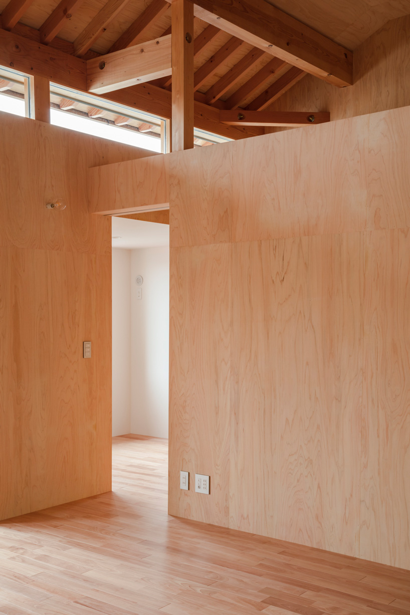 araki + sasaki architects combines three volumes into one residential complex in asaka, japan