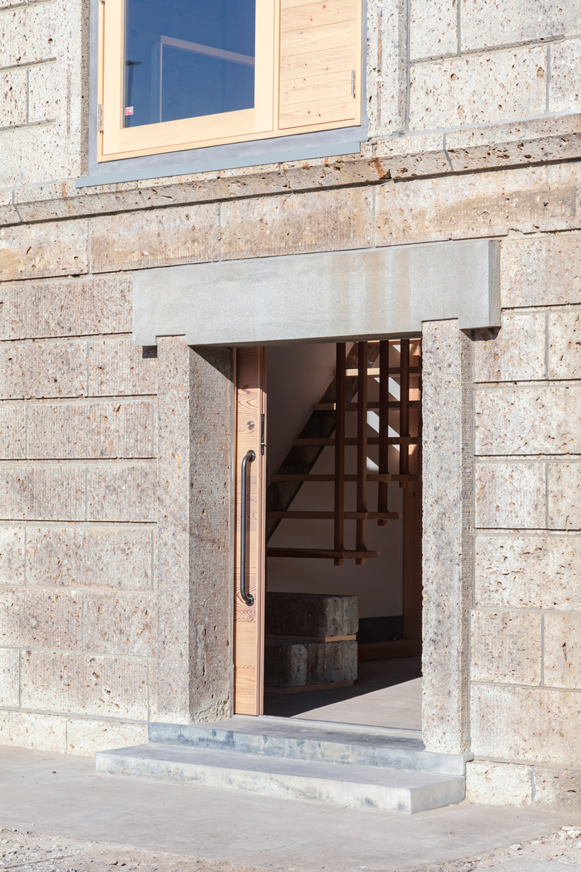 araki + sasaki architects combines three volumes into one residential complex in asaka, japan