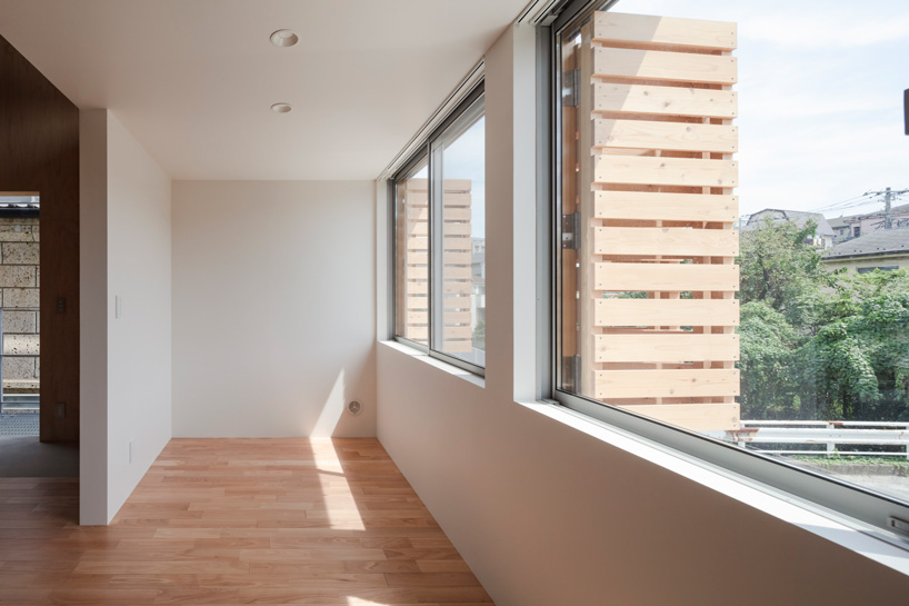 araki + sasaki architects combines three volumes into one residential complex in asaka, japan