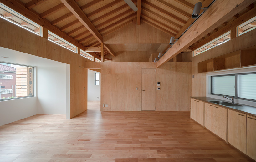 araki + sasaki architects combines three volumes into one residential complex in asaka, japan