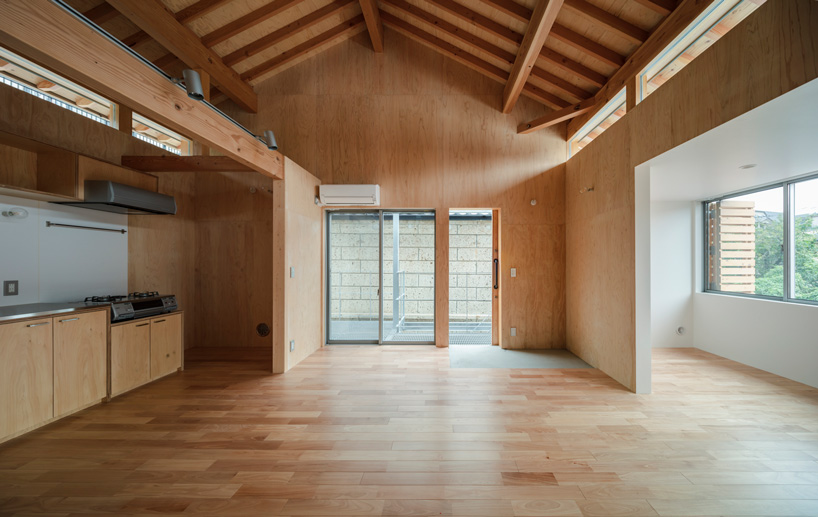 araki + sasaki architects combines three volumes into one residential complex in asaka, japan