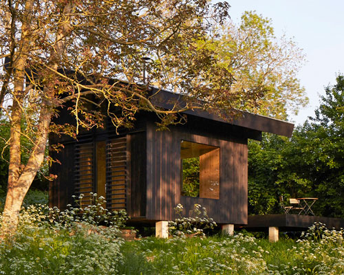 arba designs a 20sqm wooden house to inhabit a french garden in normandy