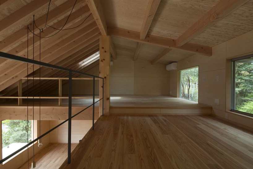 atelier thu splits japanese wooden house between two different terrain levels