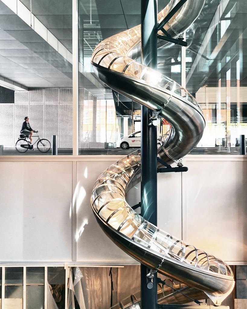 carsten höller installs 40-meter-long slide at the danish architecture center in copenhagen