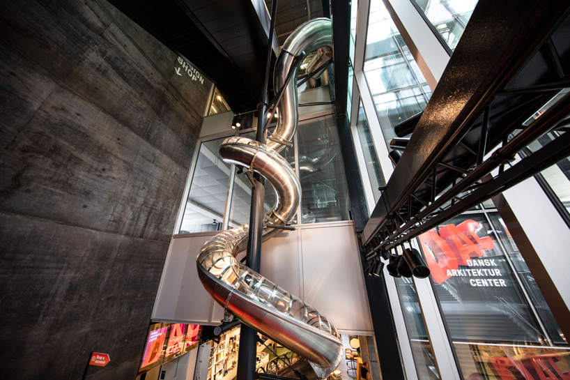 carsten höller installs 40-meter-long slide at the danish architecture center in copenhagen