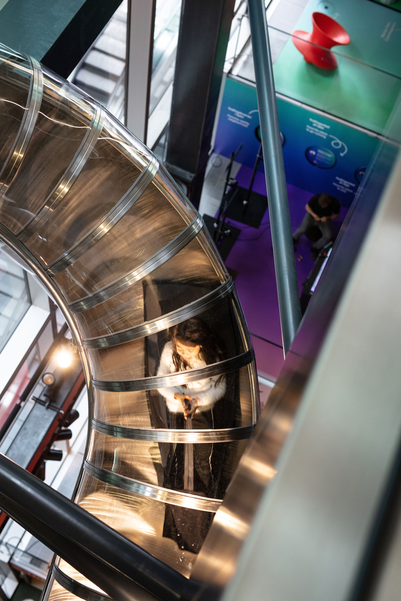 carsten höller installs 40-meter-long slide at the danish architecture center in copenhagen