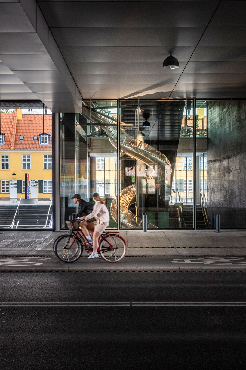 carsten höller installs 40-meter-long slide at the danish architecture center in copenhagen