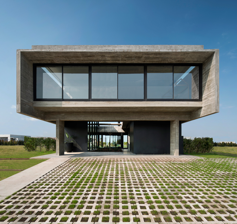 bare concrete volumes + black finishes articulate the castaños house in argentina designboom