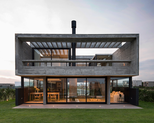 bare concrete volumes + black finishes define castaños house in argentina