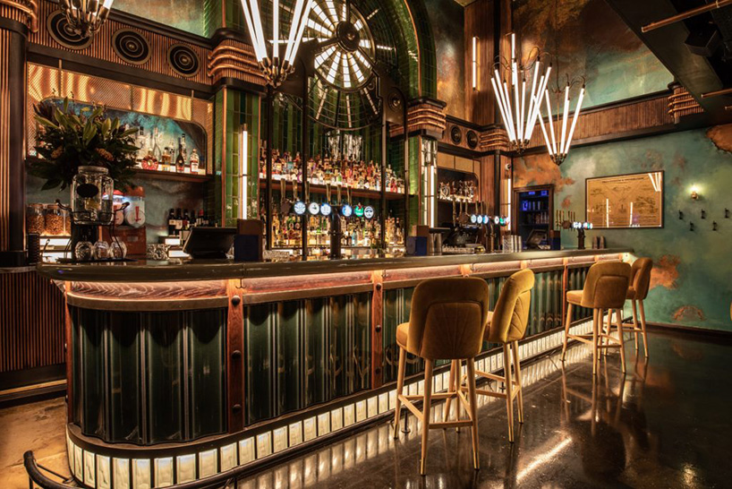 ellis design studio adds art deco elements within industrial, electric bar  interior in london