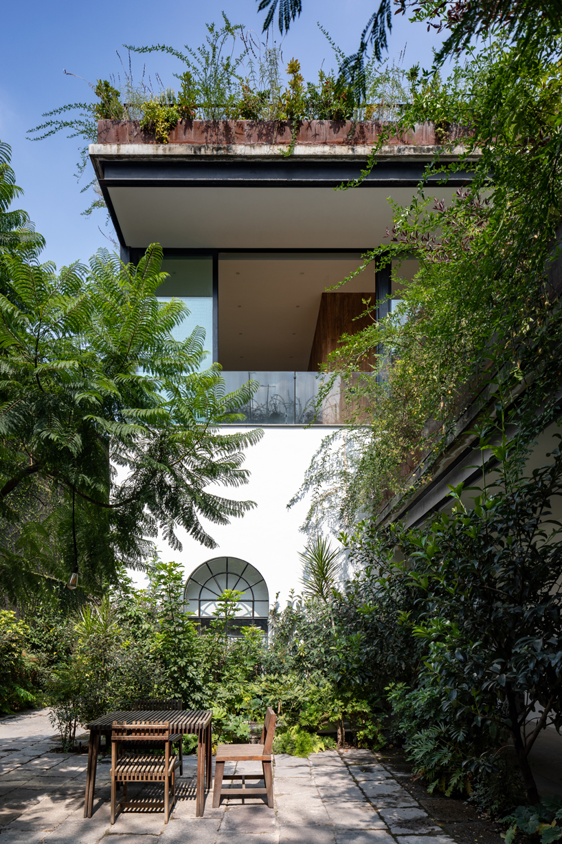 gabriel beas arquitectos converts a 1905 house into a plant-filled office in mexico city 