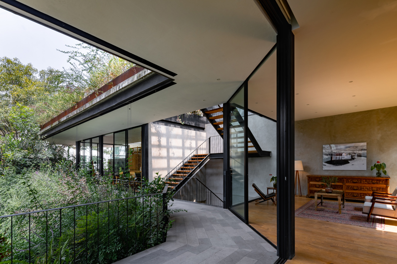 gabriel beas arquitectos converts a 1905 house into a plant-filled office in mexico city 