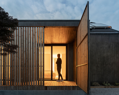 openable timber screens clad house CG by pedro henrique arquiteto in portugal
