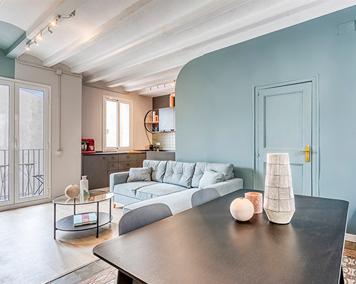 insayn design society transforms old apartment into colorful 'cappuccino flat' in barcelona