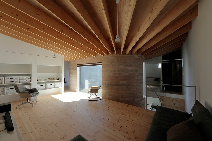 house + dance studio by international royal architecture wraps around open garden in japan