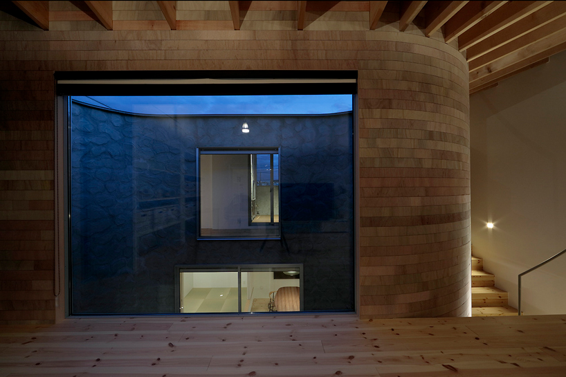 house + dance studio by international royal architecture wraps around open garden in japan