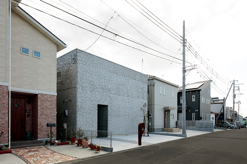 house + dance studio by international royal architecture wraps around open garden in japan