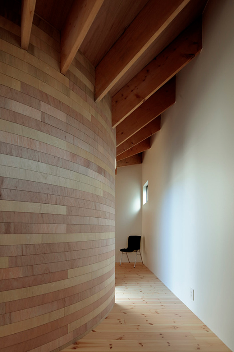 house + dance studio by international royal architecture wraps around open garden in japan