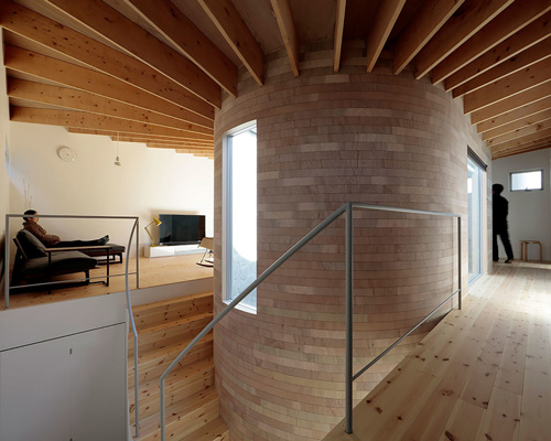 house + dance studio by international royal architecture wraps around open garden in japan