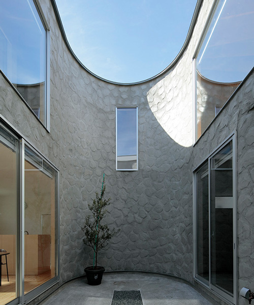 house + dance studio by international royal architecture wraps around open garden in japan