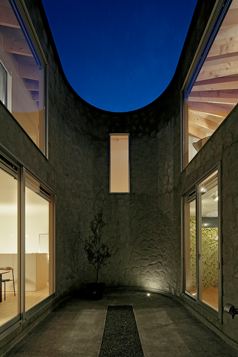 house + dance studio by international royal architecture wraps around open garden in japan