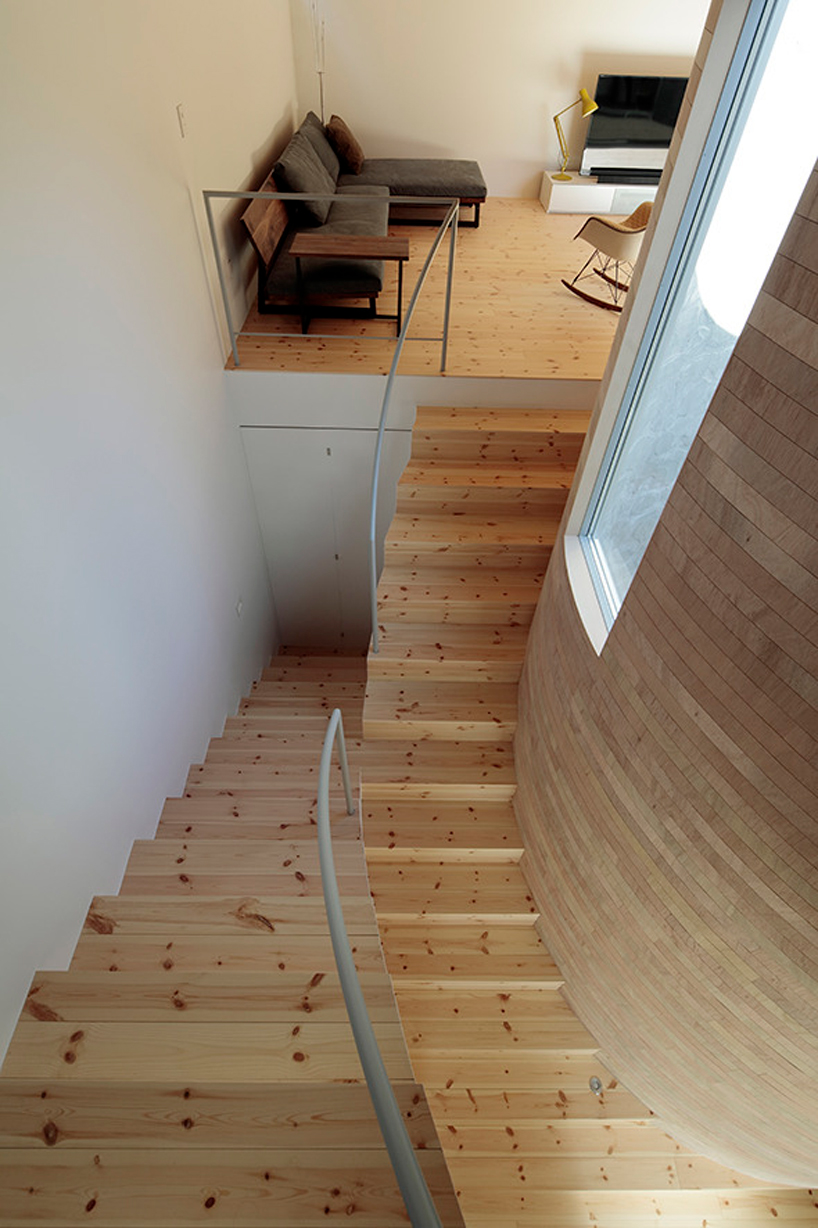 house + dance studio by international royal architecture wraps around open garden in japan