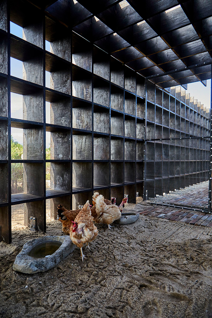 kengo kuma's chicken coop for casa wabi is an interlocking system of charred wooden boards