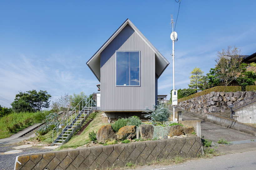 SNARK + OUVI top wooden house in saishikada, japan, with pitched roof