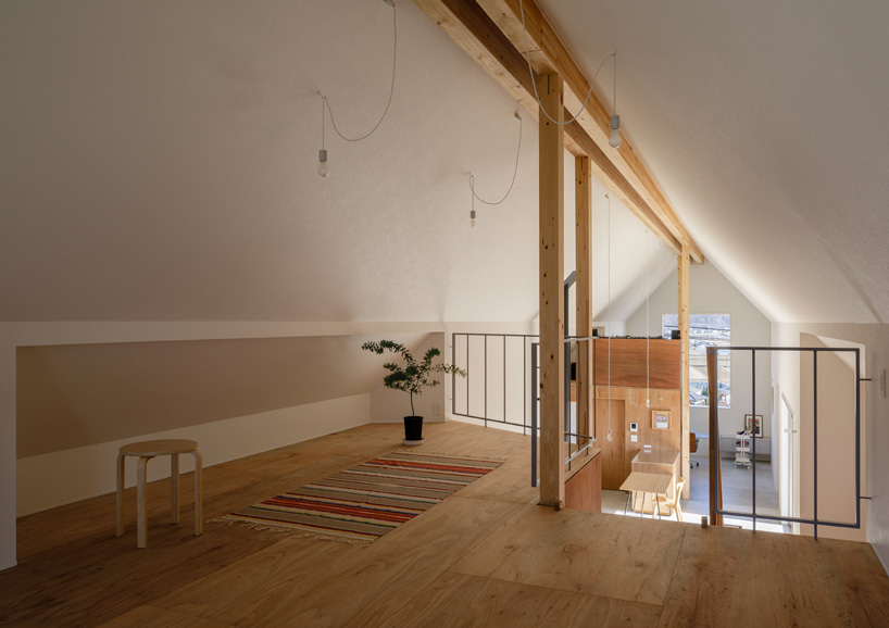 SNARK + OUVI top wooden house in saishikada, japan, with pitched roof