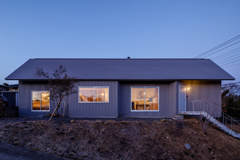SNARK + OUVI top wooden house in saishikada, japan, with pitched roof