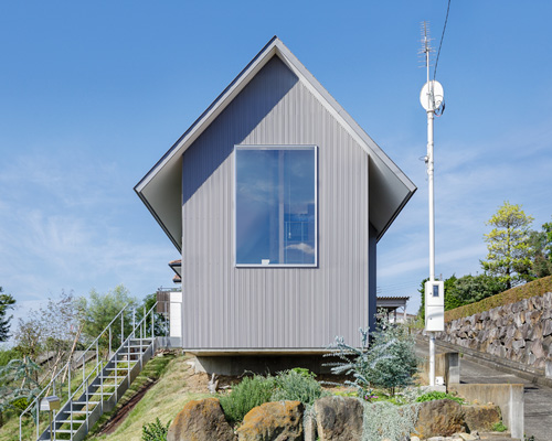 SNARK + OUVI top wooden house in saishikada, japan, with pitched roof