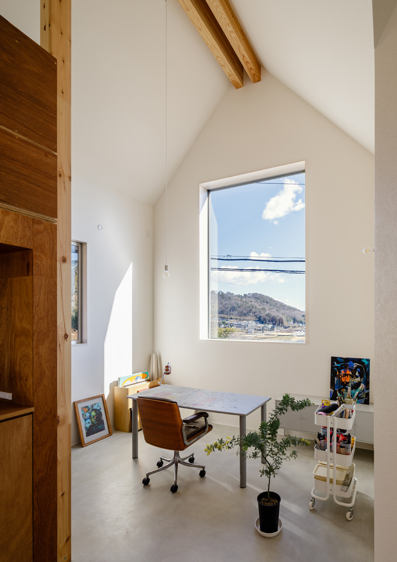 SNARK + OUVI top wooden house in saishikada, japan, with pitched roof