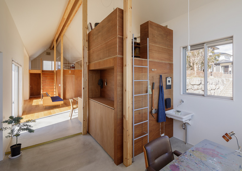 SNARK + OUVI top wooden house in saishikada, japan, with pitched roof