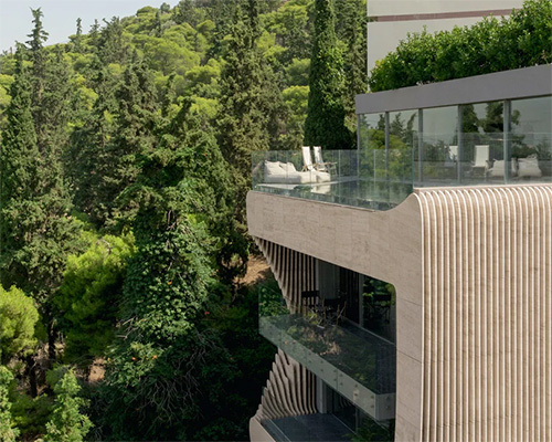 omniview applies organic marble facade to private residence in athens, greece
