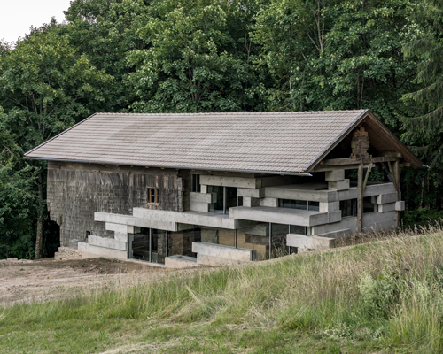 peter haimerl revives a bavarian farmhouse with glass and concrete insertions
