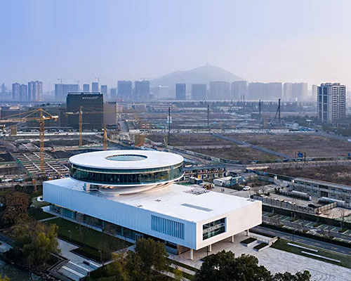 e+lab's round exhibition center with 360° window in china offers urban panoramic view