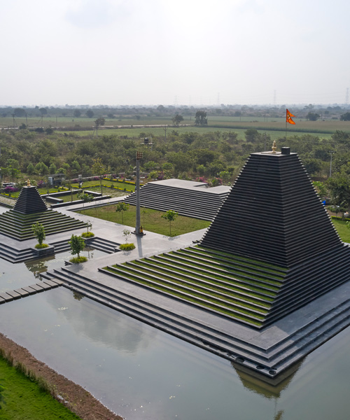 sP+a constructs temple in india with shrines made from black limestone