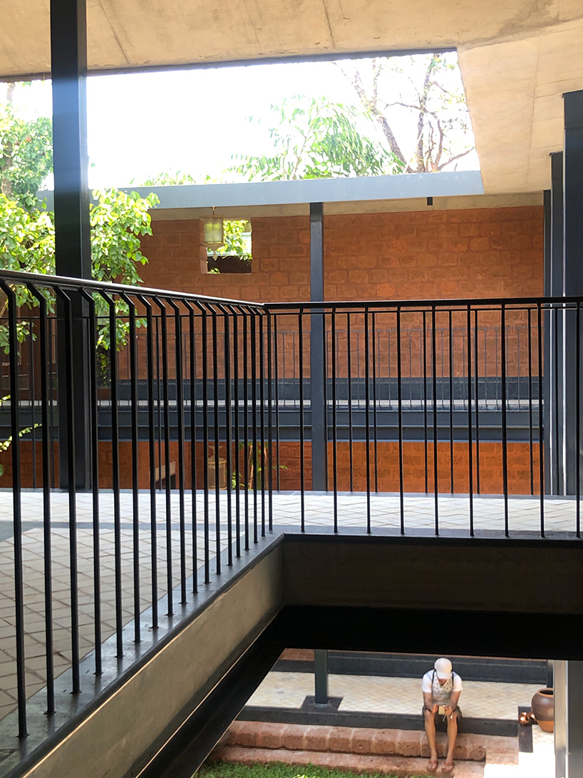sP+a builds 'house of multiple courts' in goa using laterite stone blocks