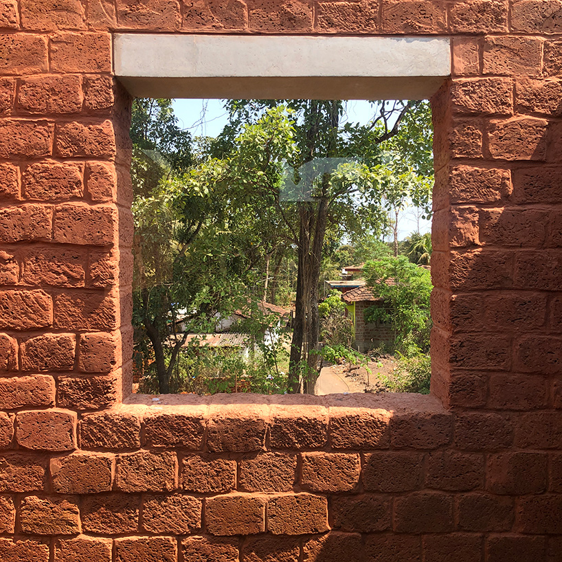 sP+a builds 'house of multiple courts' in goa using laterite stone blocks